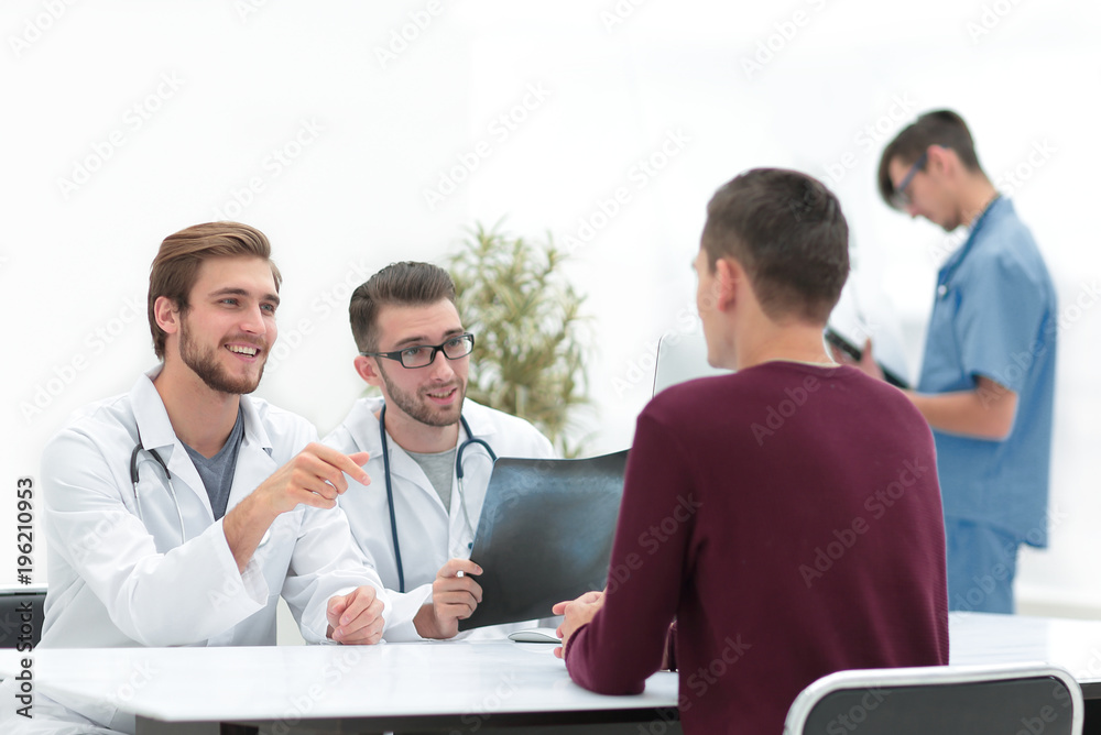 doctors discuss with the patient the x-ray doctors discuss with the patient the x-ray