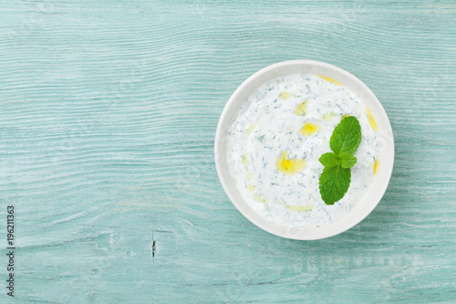 Greek sauce tzatziki from sour cream yogurt. Traditional mediterranean dip or dressing. Top view.