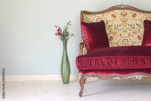 Red classical style sofa in the room.