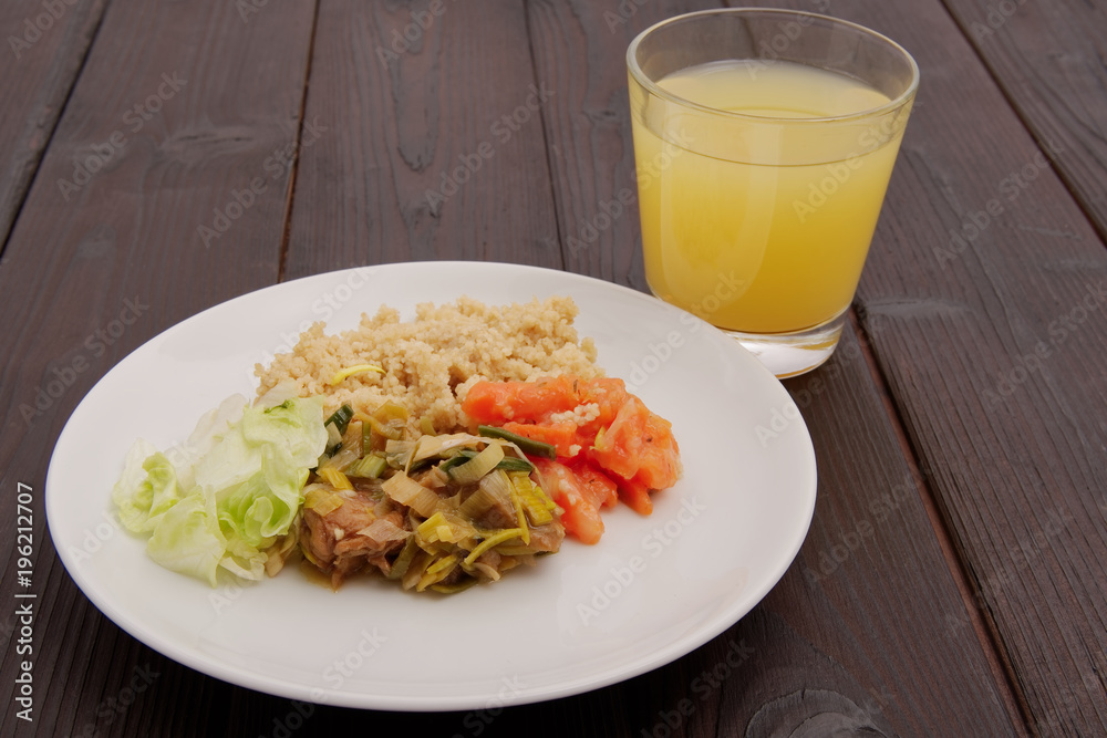 Wheat gluten on leek with couscous on a table Wheat gluten on leek with couscous on a table