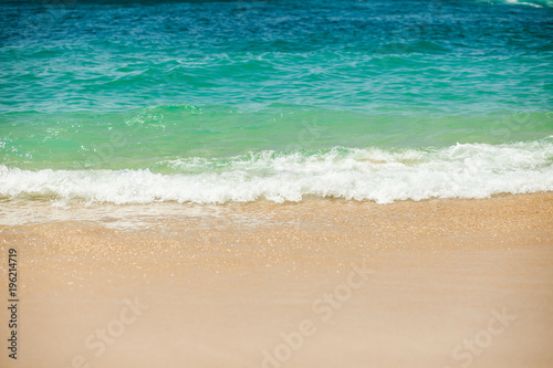 Sea wave to the sandy beach