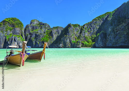 Maya Bay beach with two longtail boats, Ko Phi Phi Leh Island, Thailand © EMrpize
