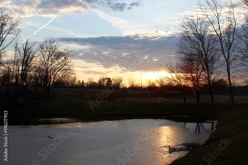 The sunset over the lake in the countryside. © Al