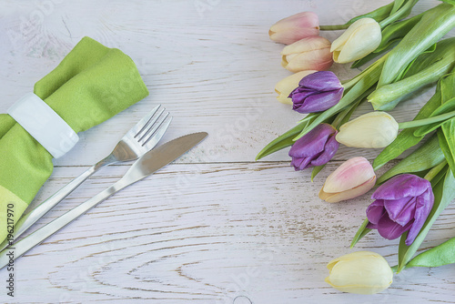 Fototapeta Naklejka Na Ścianę i Meble -  Festive table setting with bouquet of fresh tulips