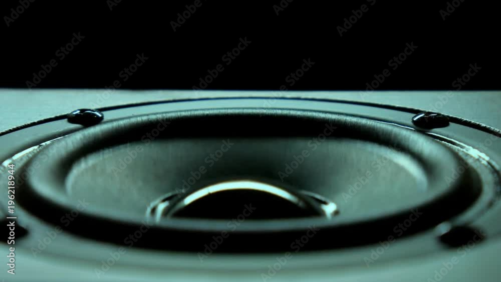 Closeup at moving sub-woofer. Speaker part music. Background. Closeup at moving sub-woofer. Speaker part music. Background.