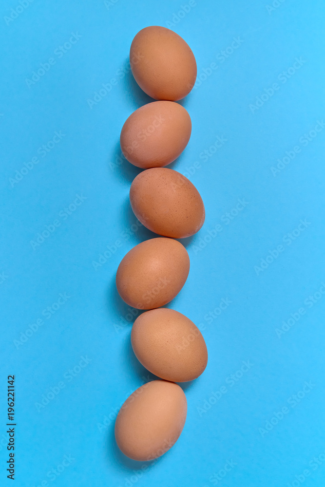 Brown eggs on blue background, copy space. Healthy food concept. Top view, flat lay. Easter eggs. Happy Easter concept Brown eggs on blue background, copy space. Healthy food concept. Top view, flat lay. Easter eggs. Happy Easter concept