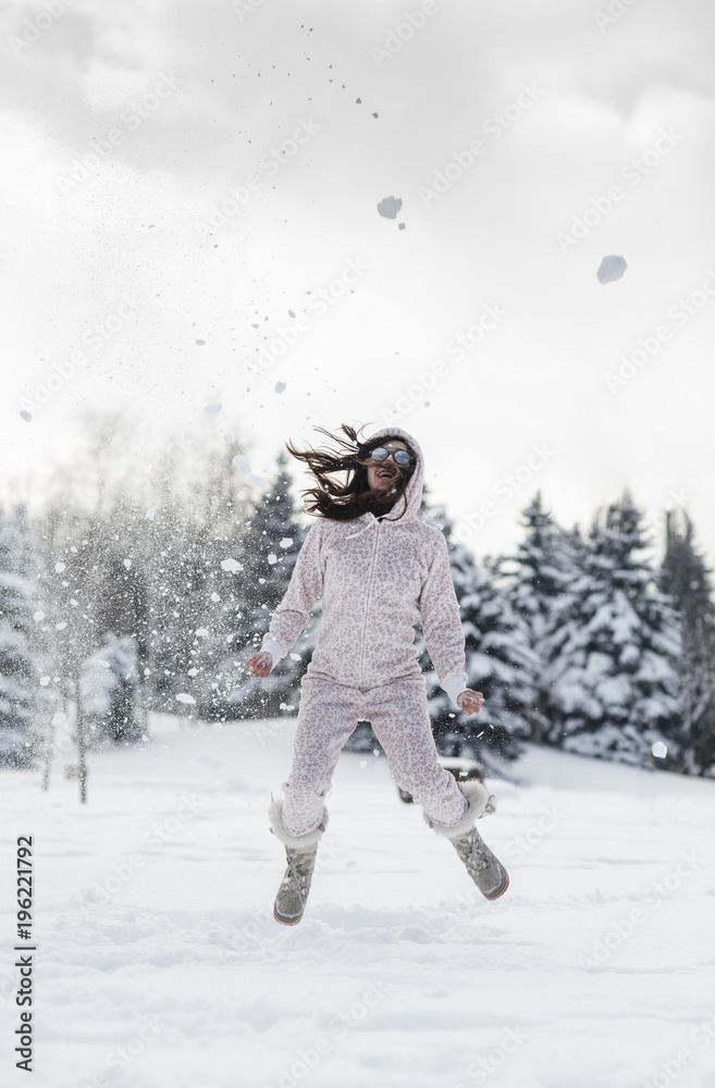 Young beautiful woman wearing onesie