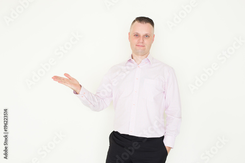 Serious mid adult businessman advertising product