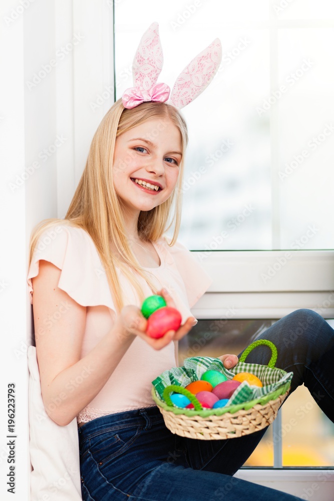 Teenage girl holding Easter eggs Teenage girl holding Easter eggs