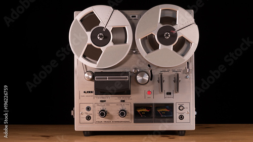 Vintage Reel to Reel tape recorder playing music 
