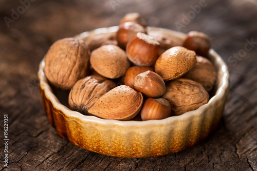 Mixed Nuts on Rustic Wooden Table