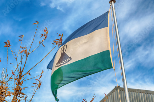    in the cloudy sky waving flag photo