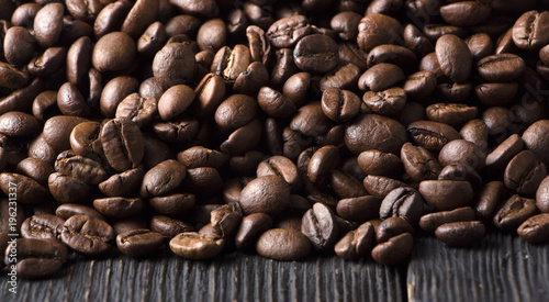 roasted coffee beans on wood texture