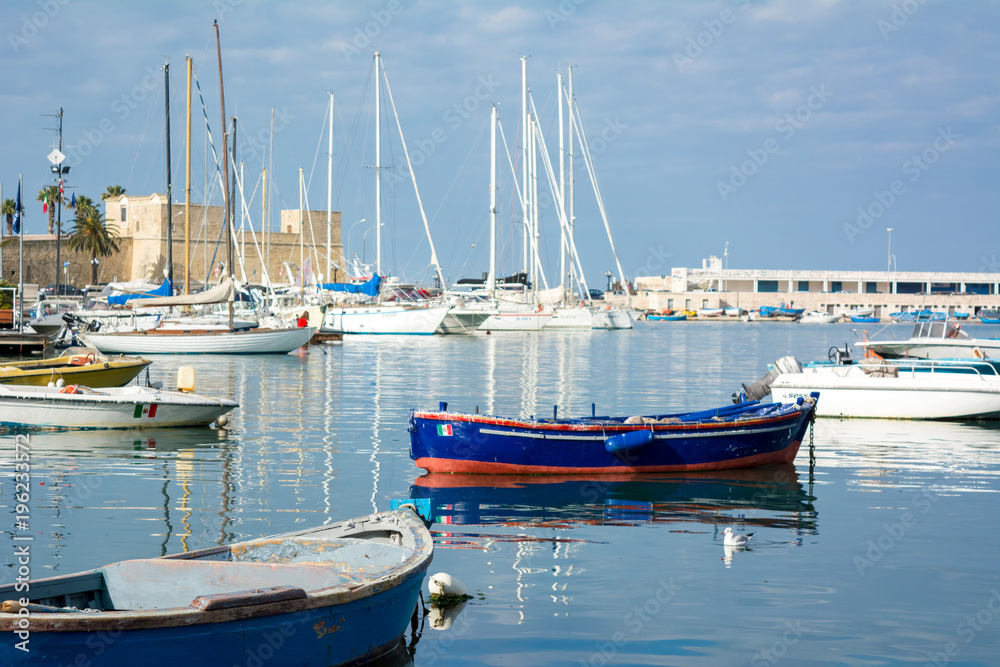 Horizontal View of Boats Moored in the Bari Touristic Harbour on Partially Cloudy Sky Background. Bari, South of Italy Horizontal View of Boats Moored in the Bari Touristic Harbour on Partially Cloudy Sky Background. Bari, South of Italy