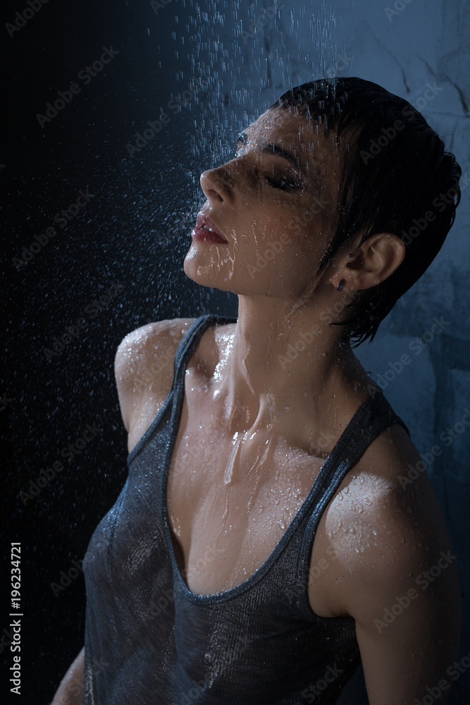 Sexy brunette in wet t-shirt high angle view Stock Photo | Adobe Stock