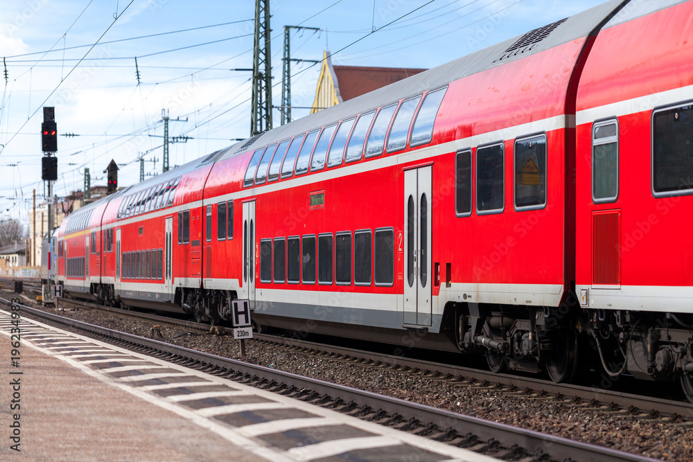 a german train passes a train station