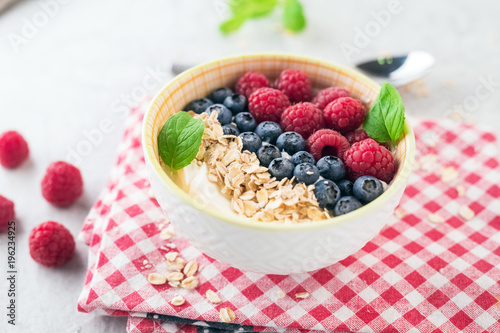 Yogurt with blueberry, raspberry and oatmeal flakes