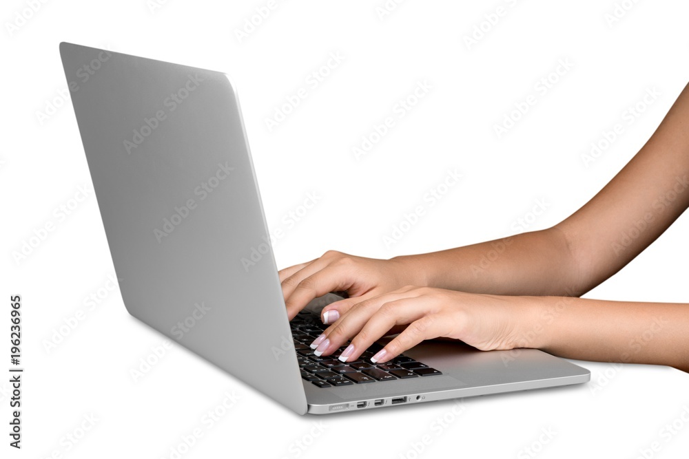 Hands typing on keyboard of modern laptop Hands typing on keyboard of modern laptop