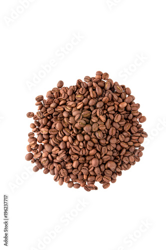 Coffee grains scattered over the surface. A bunch of roasted coffee beans close-up.