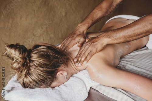 Young woman receiving massage photo