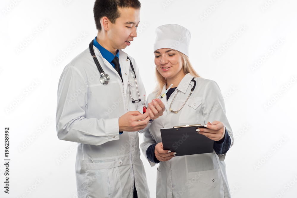 Studio portrait of young doctors in uniform Studio portrait of young doctors in uniform