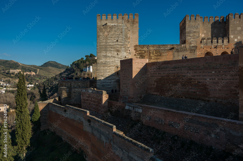 Walls and tower of Alcazaba, citadel of Alhambra, Nasrid. Granada, Spain.