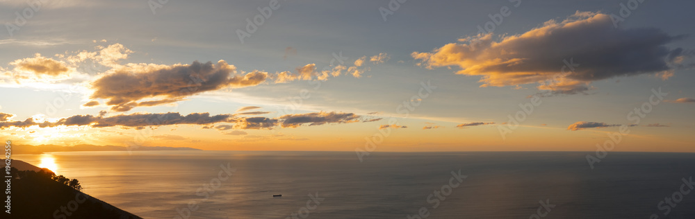 Sun at sunset on the coast of Gipuzkoa on the sea, Basque Country