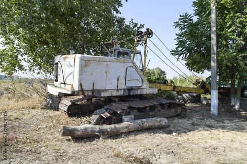Old quarry near the dragline. Old equipment for digging the soil in canals and quarries.
