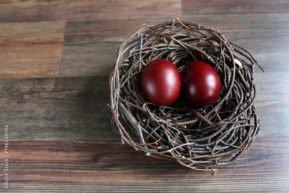 Easter eggs in the nest on wooden background Easter eggs in the nest on wooden background