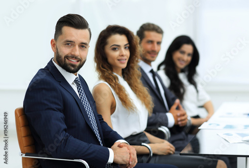 group of business people sitting at the desktop