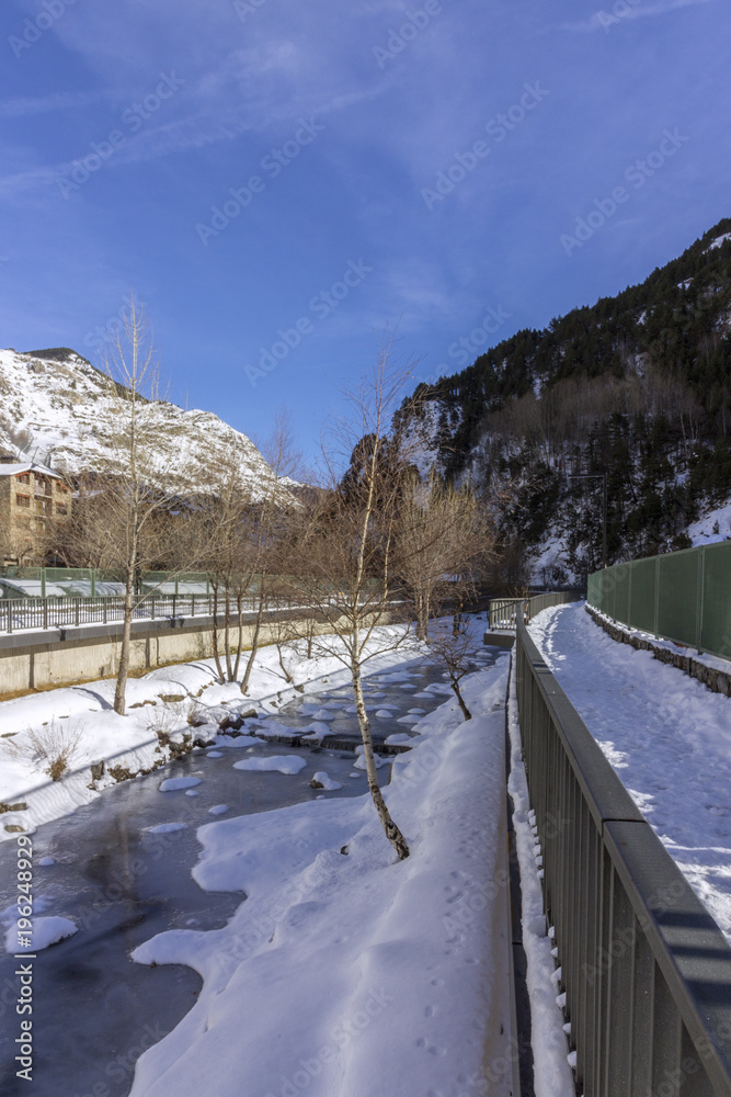 Obraz premium Valira river througt town of Canillo village. Andorra.