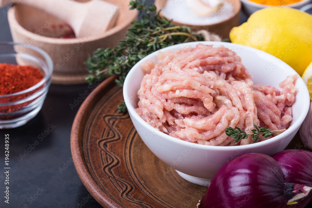 Minced chicken meat.  Fresh ingredients for healthy meal preparation
