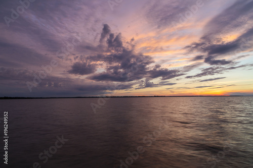 Dramatic clouds at sunset on a calm lake