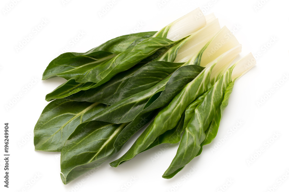 Spinach leaves close up isolated on white. Spinach leaves close up isolated on white.