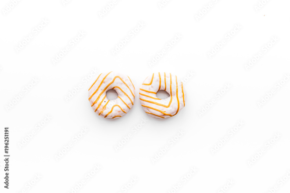 Unhealthy tasty sweets. Glazed donut on white background top view copy space