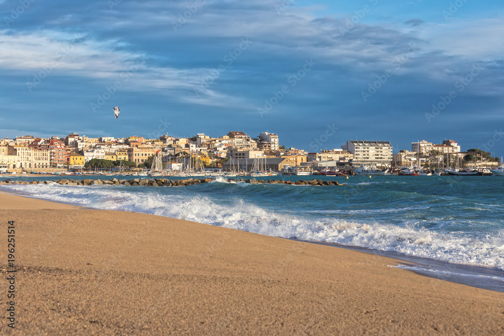 Big waves in a sunny day in Palamos, Costa Brava, Spain