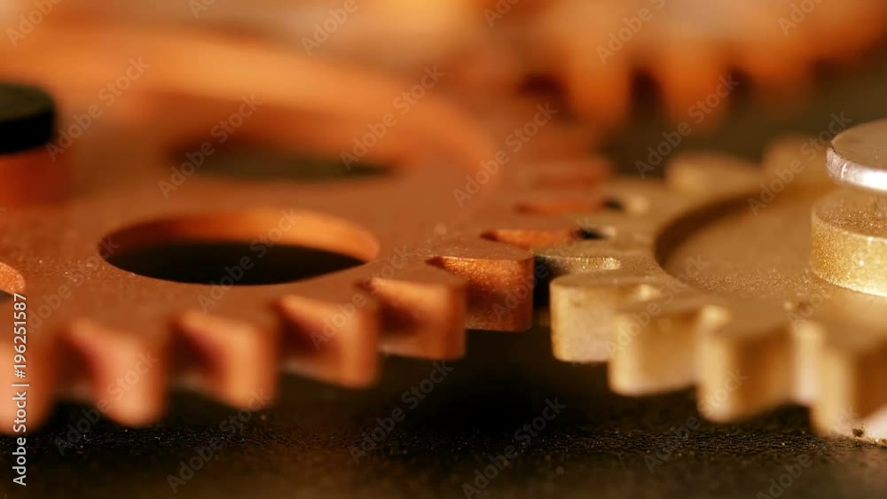 clock wheels turning,touching each other - macro clock wheels turning,touching each other - macro