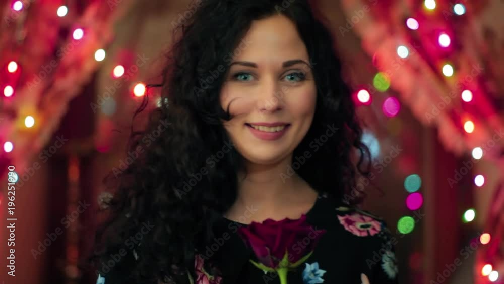 girl by the window with a garland girl by the window with a garland