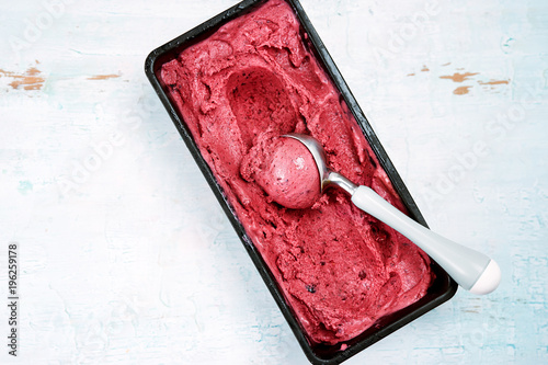 Bild auf Leinwand Top view of red berries sorbet with scoop