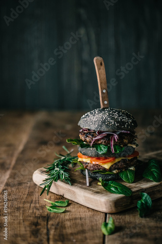 Delicious double black burger with spinach and beef 