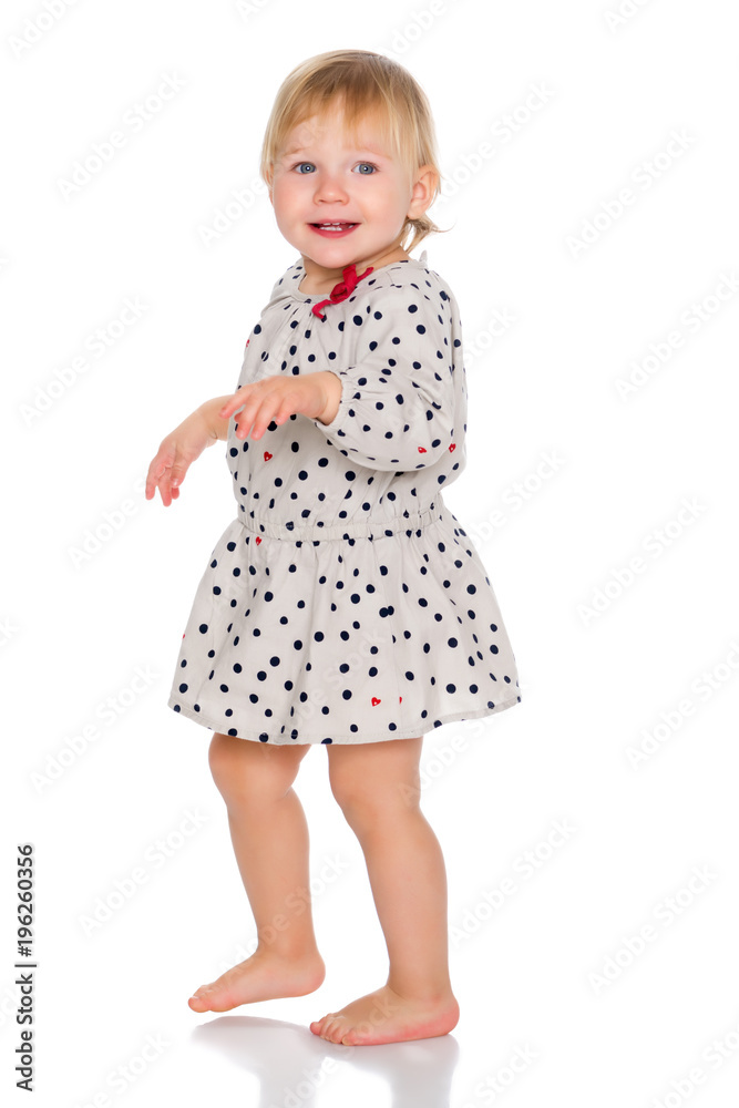 A nice little girl in a short dress. A nice little girl in a short dress.