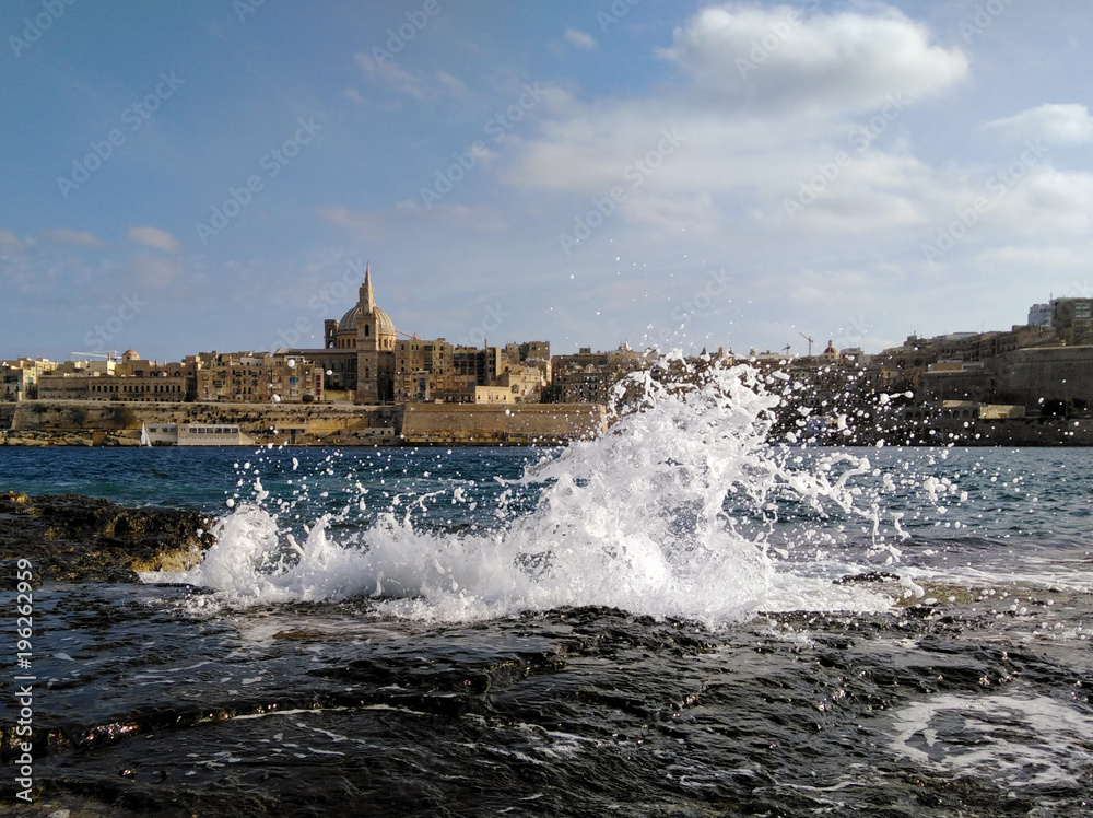 Malta Old city Valetta view with sea wave spalsh