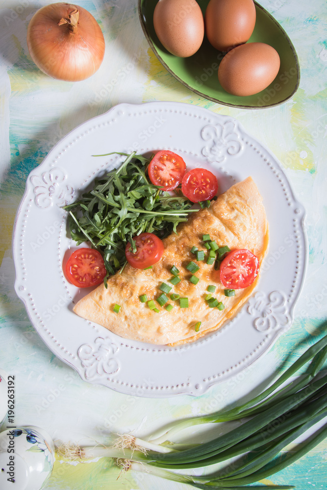 Omelet, fried chicken eggs with fresh vegetables Omelet, fried chicken eggs with fresh vegetables