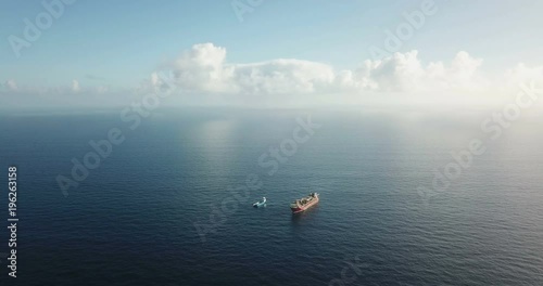 Aerial view of an offshore oil installation and supply ship