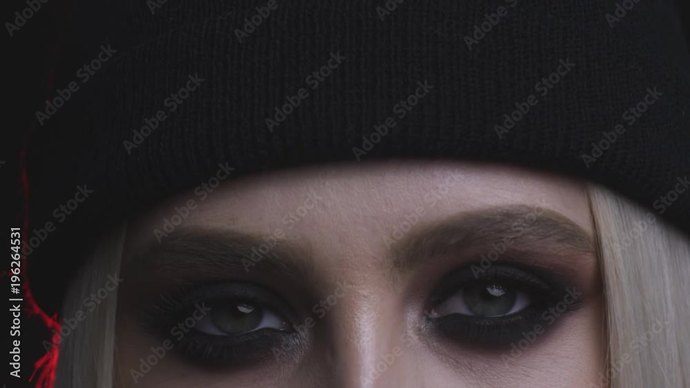 beautiful blonde girl with smoky eyes makeup posing in studio with red light beautiful blonde girl with smoky eyes makeup posing in studio with red light