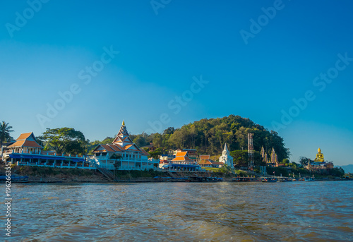 Outdoor view of houses and buildings at the riverbank located at golden triangle Laos