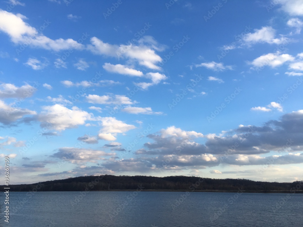 blue sky with clouds over Potomac river