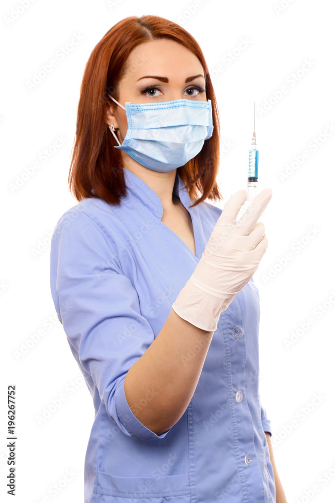 Healthcare and medicine. Woman doctor, a nurse with a syringe in her hands, uses, picks up a syringe isolated on white background Healthcare and medicine. Woman doctor, a nurse with a syringe in her hands, uses, picks up a syringe isolated on white background