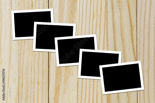 Photo frame blank on wood background with space