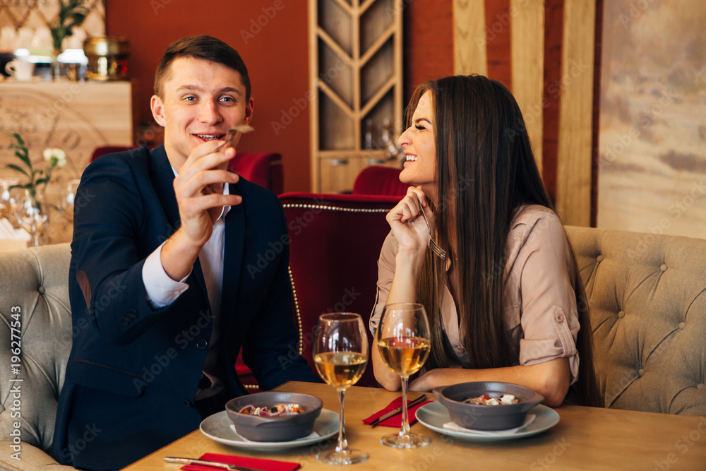 Dating concept, couple drinking wine in a restaurant Dating concept, couple drinking wine in a restaurant